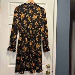 Elegant Black & Gold Floral Long Sleeve Dress with Ruffles at the Neck & Waist